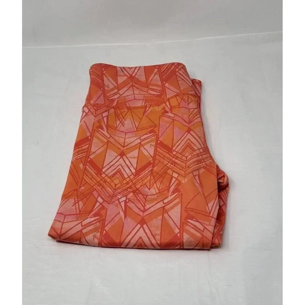 Alo Yoga Geometric Capri Cropped Leggings in Guava Indio Orange/Coral Size M